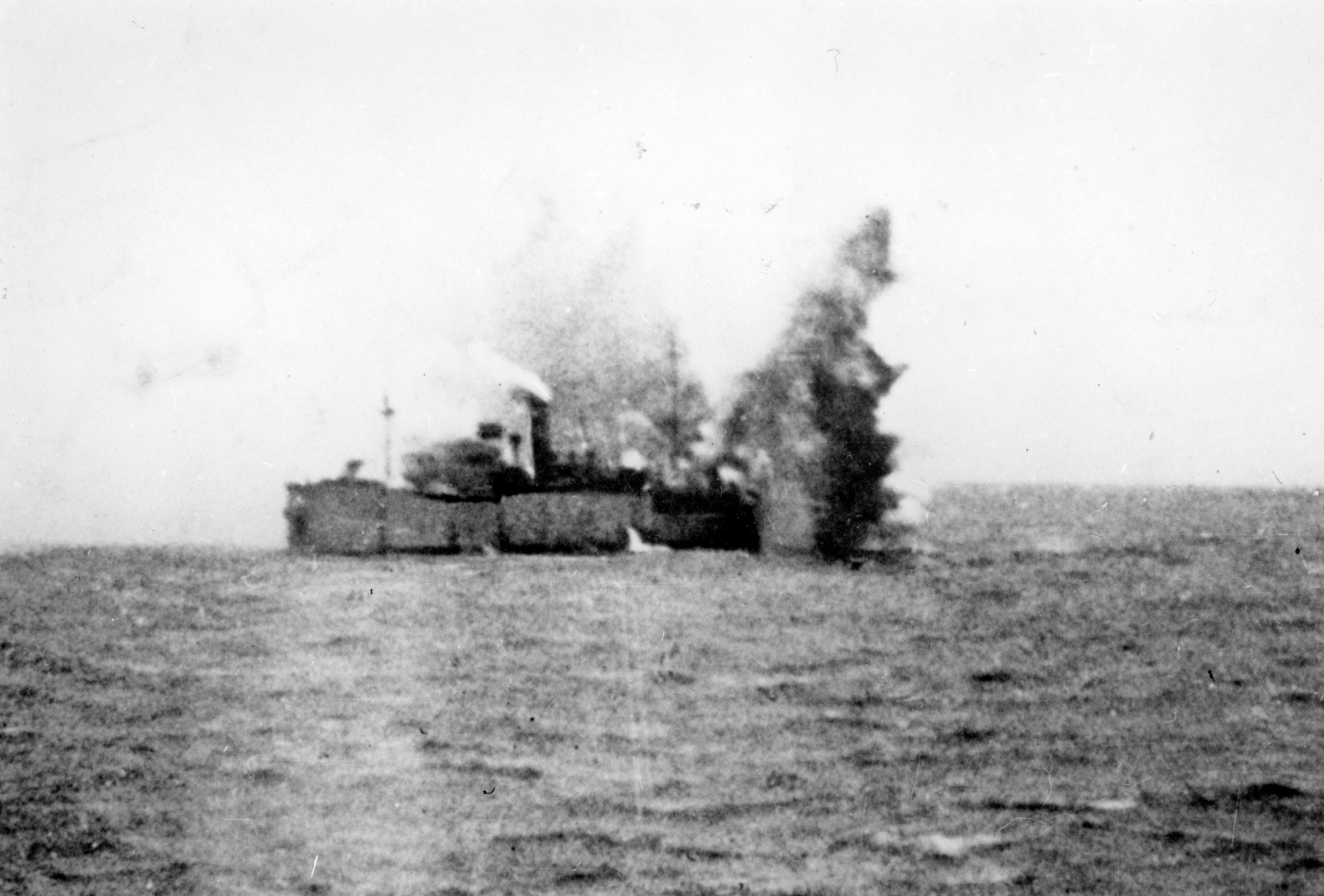 The British freighter Navarrino takes a hit from a torpedo launched by a Heinkel. 