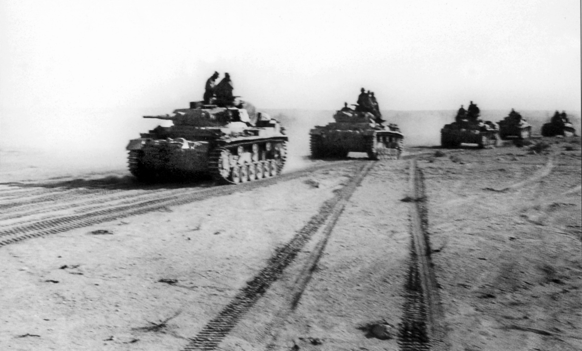 German Panzers advance through the desert toward Tobruk and the British forces at Sidi Rezegh.