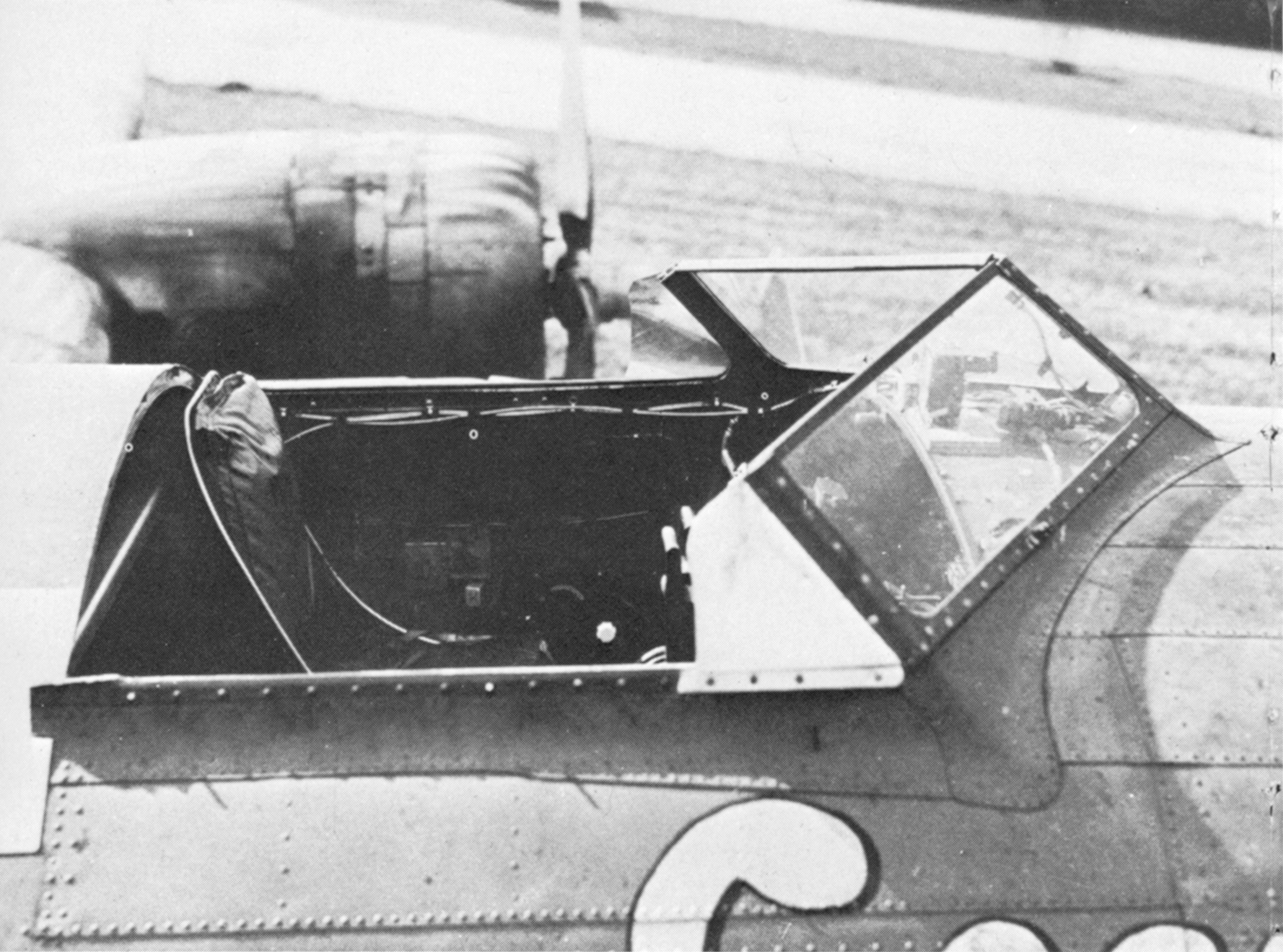 The cockpit of an adapted, stripped-down B-17 with the top removed.