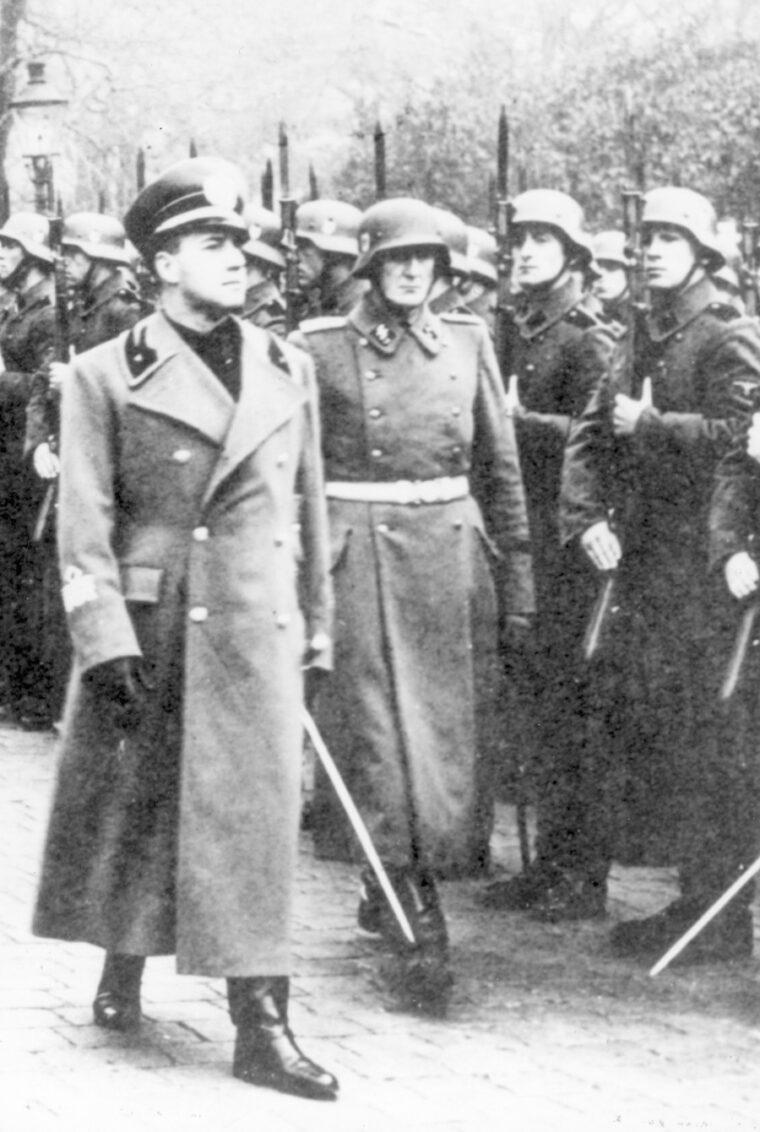 Italian Fascist Foreign Minister Galeazzo Ciano (left) reviews an honor guard of the SS Lifeguard Regiment Adolf Hitler in Nazi Germany during the war.