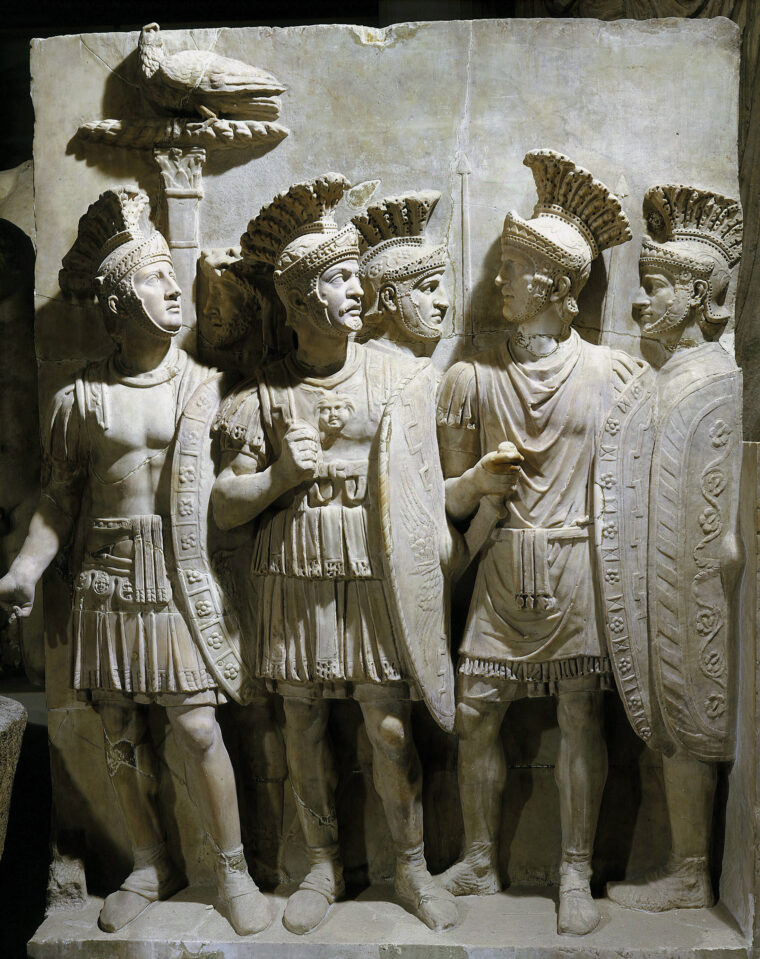 Roman soldiers in some of their warrior trappings. They had the advantage of discipline, tactics, and engineering in their clashes with Gallic tribes. 