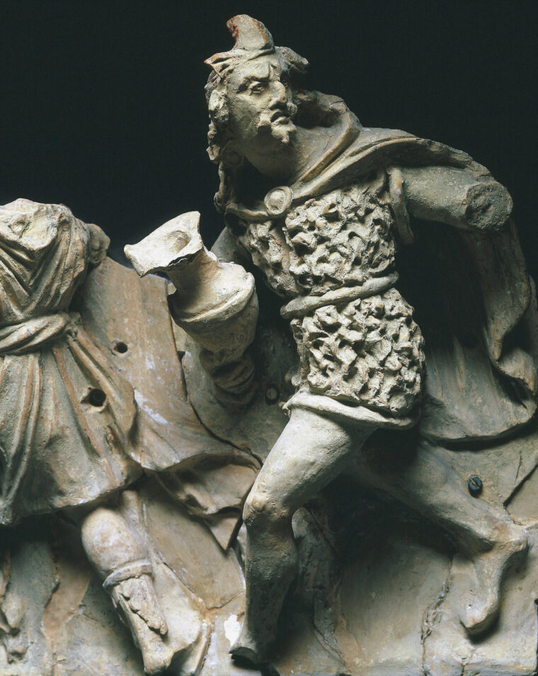 A 2nd-century temple frieze shows a Gallic warrior fleeing a battle against Roman troops.