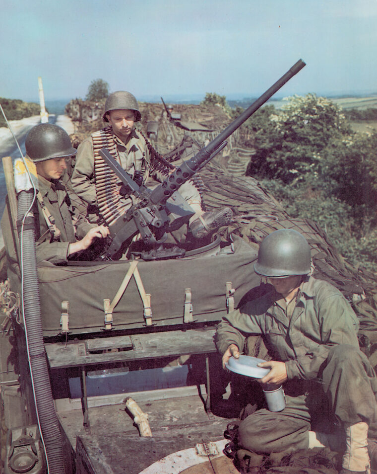 Arising out of the fertile mind of inventor John M. Browning, the M2 .50-caliber machine gun was an adaptation of the smaller .30-caliber type. At right, GIs in France on a halftrack with a .50-caliber.
