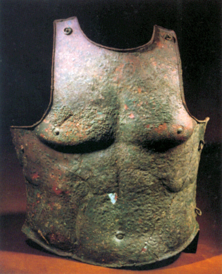 A Greek bronze cuirass of a period slightly more recent than the famous march.  Rings are for straps to hold the armor to the body.
