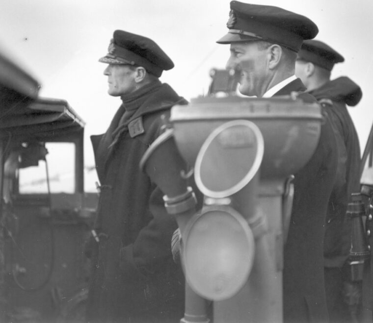 Captain Philip Vian (left) observes naval exercises from the destroyer HMS Cossack in 1940. 