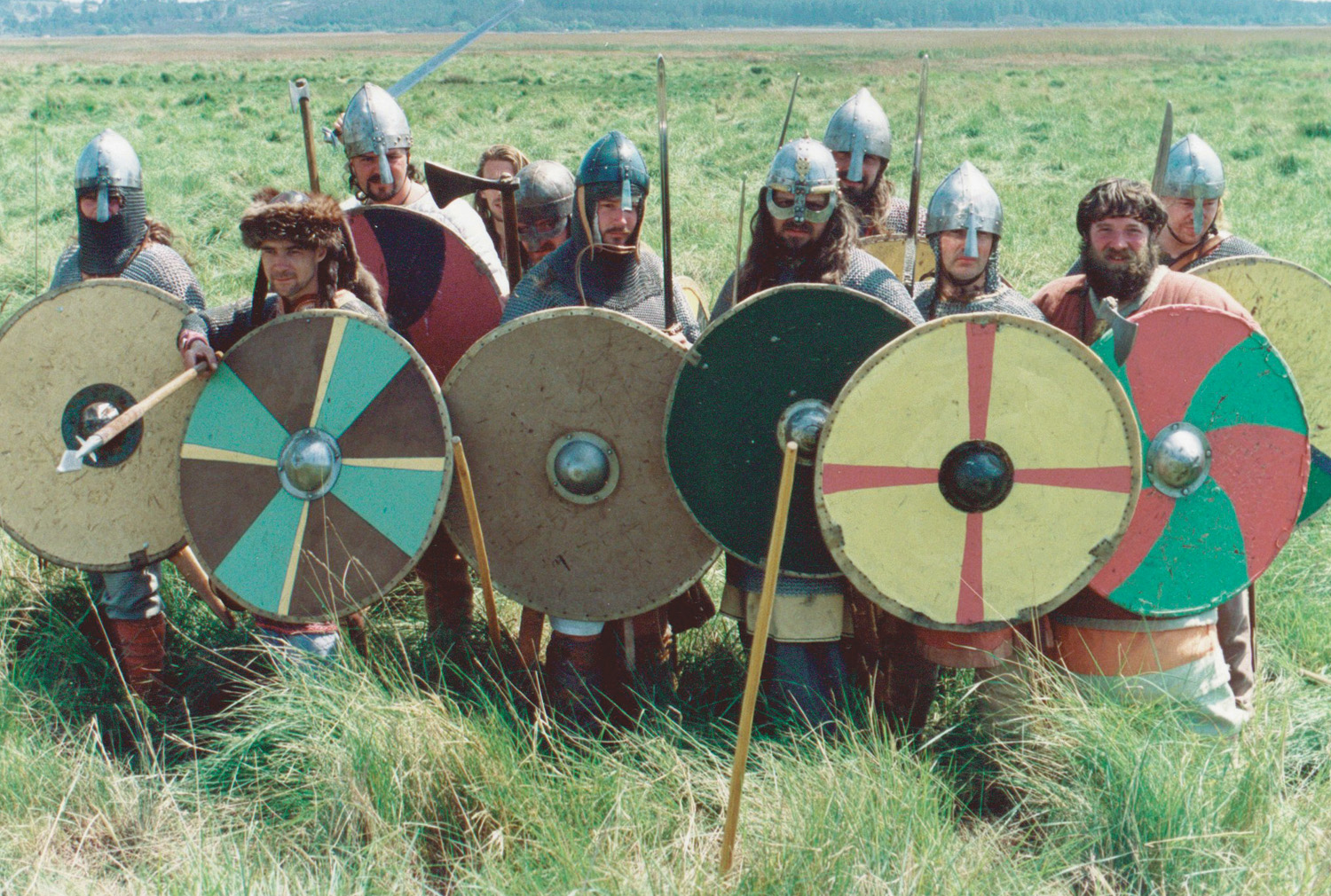 Recreated ninth-century warriors of the Regia Anglorum living history group form a shield wall.