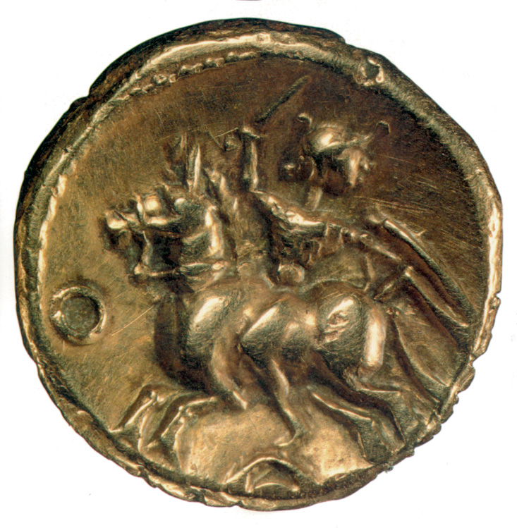 A Gaul with sword raised rushes into battle.