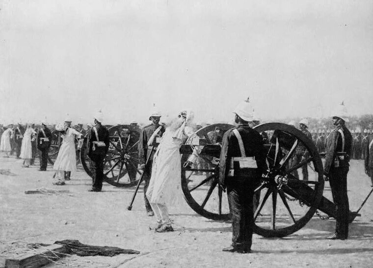 In a grisly scene of execution, captured rebels are strapped to cannons before being blown to pieces.