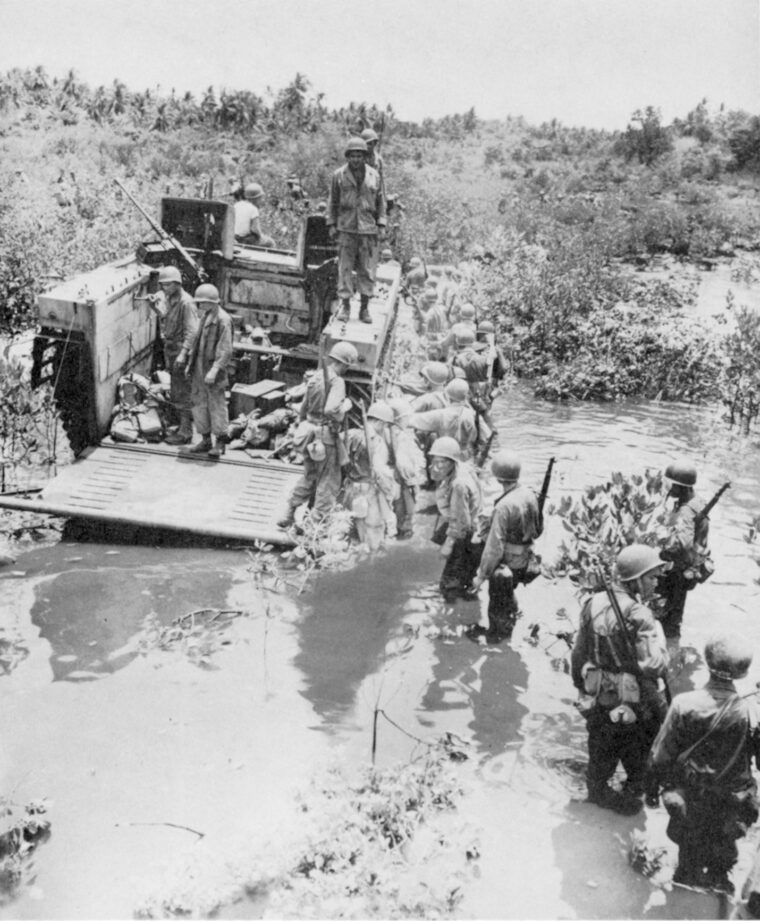 American troops disembark 
an amtrack, one of the 
amphibious vehicles used 
in the Los Baños raid.