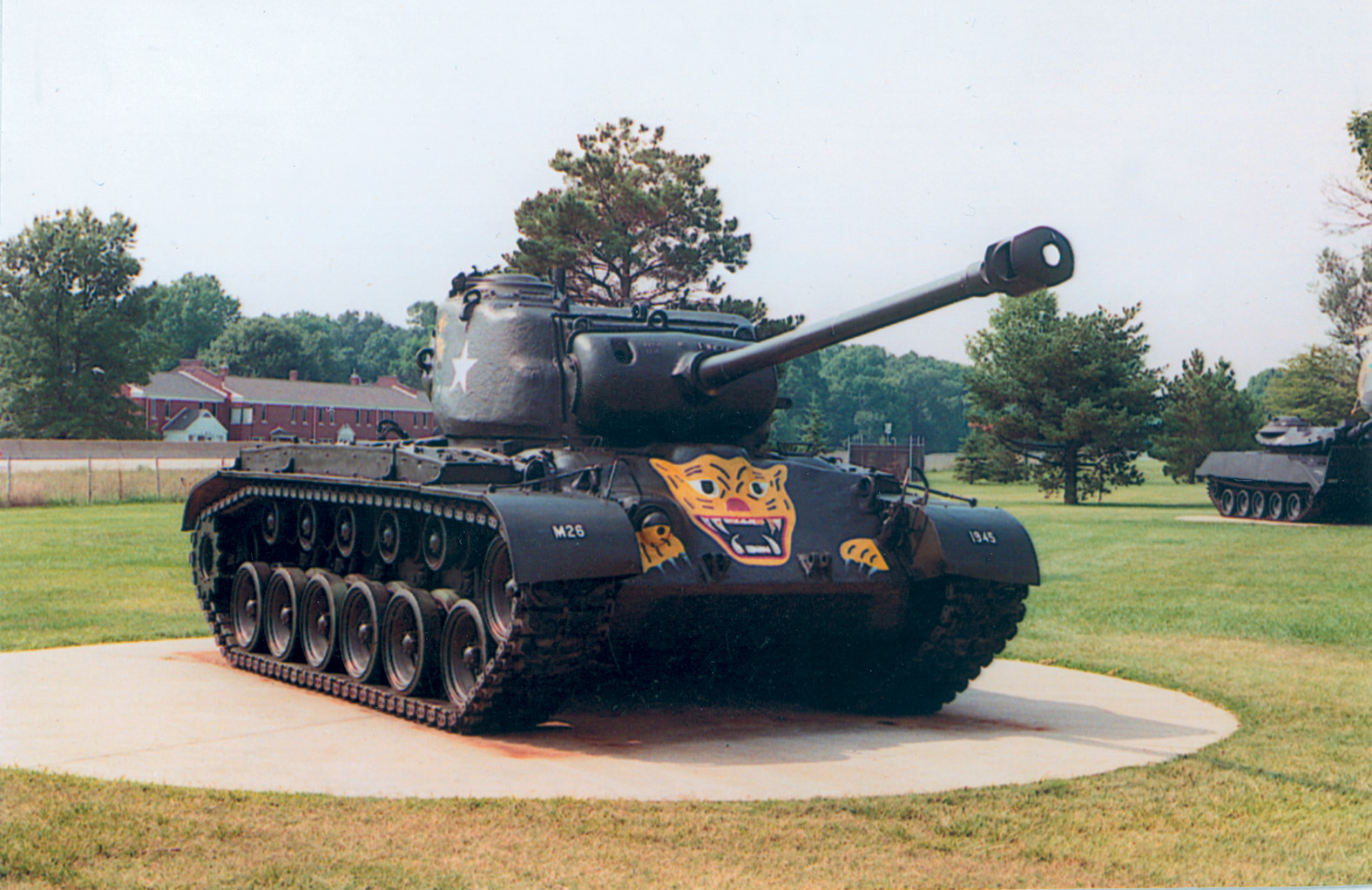 An M26 Patton tank with tiger decals. Below: The Patton Museum.