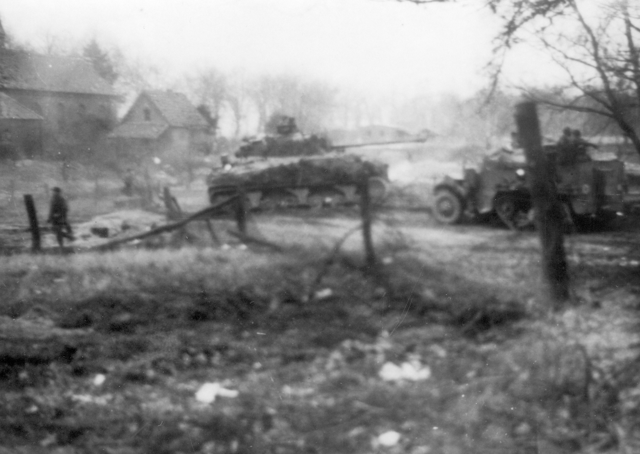A Sherman “Firefly” and M3 half-track, part of the 15th Scottish Division, reach the Canadian paratroopers late in the day on March 24.