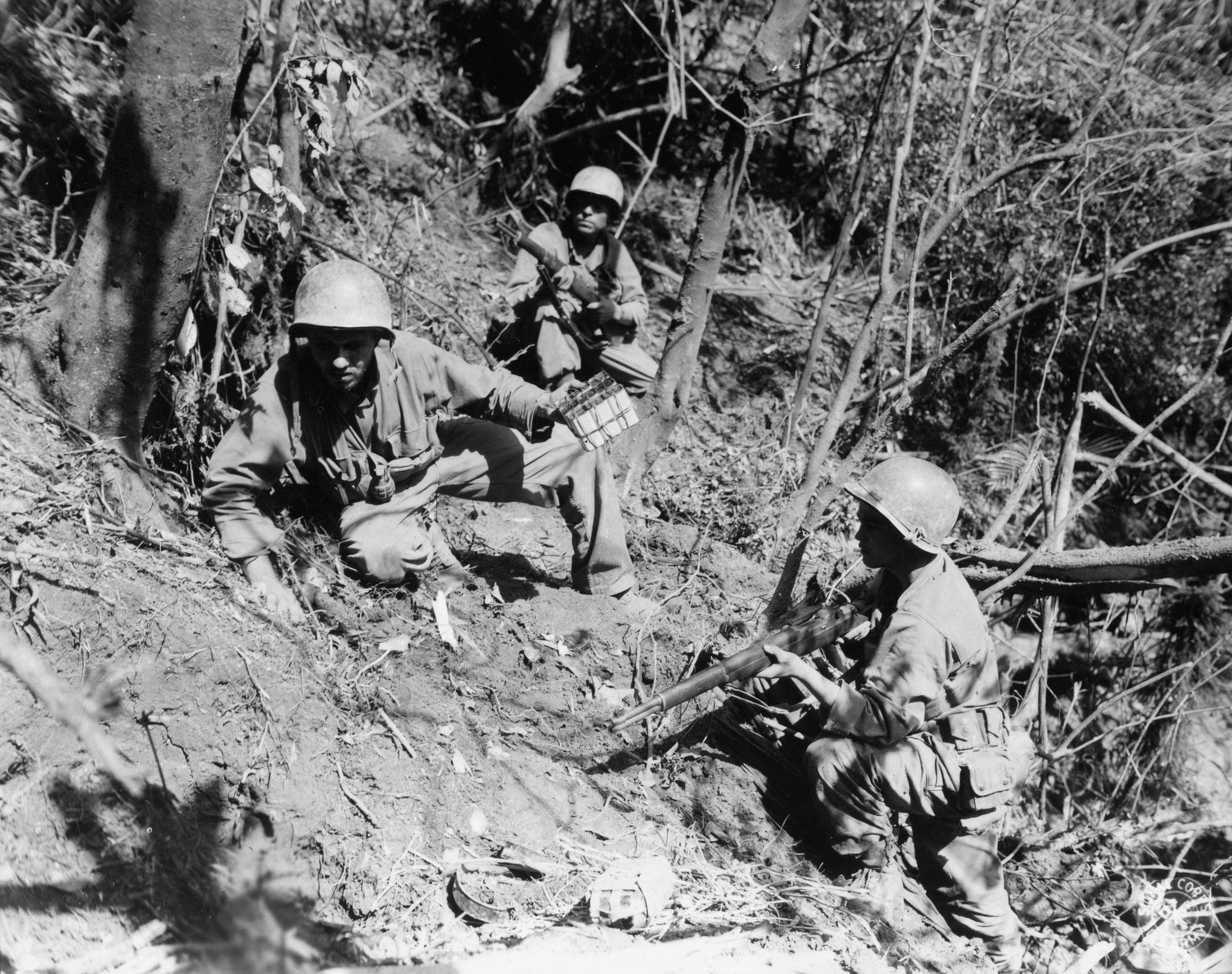 Along Luzon’s Villa Verde Trail, soldiers of the 38th Infantry Division seal the entrance to a Japanese-held cave with high explosives. The inhabitants were trapped inside and suffocated.