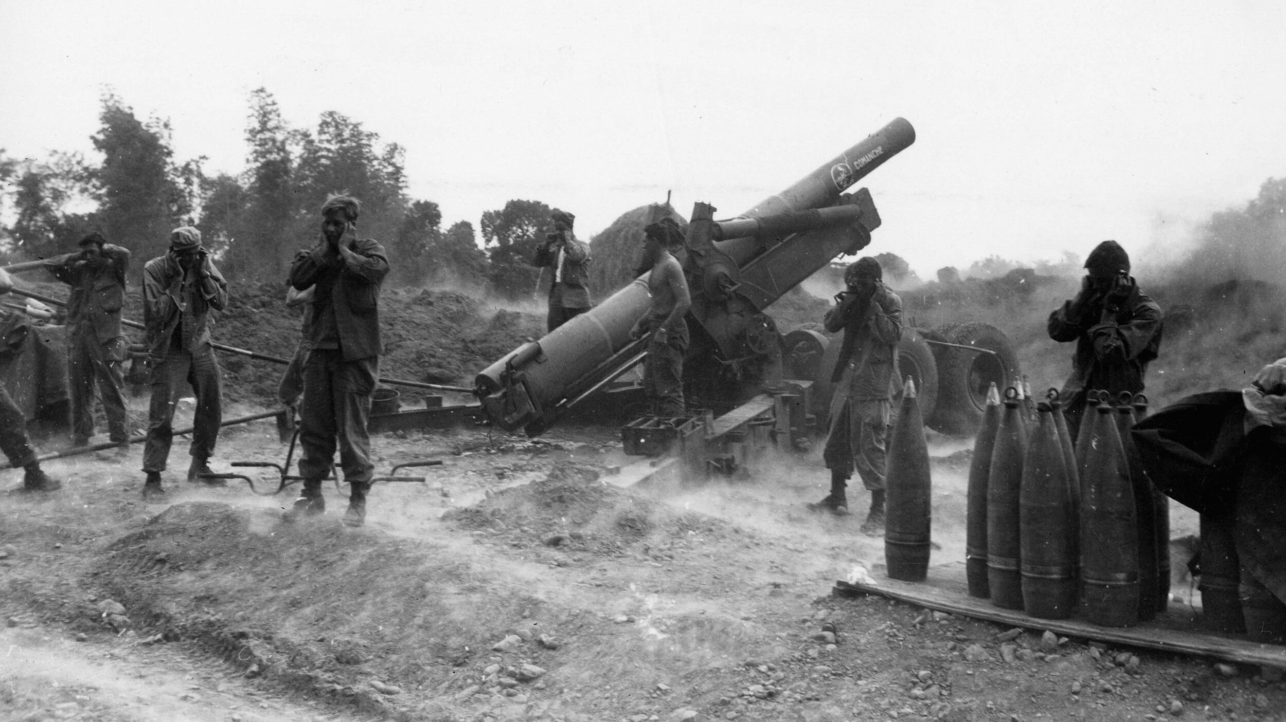 The crew of an 8-inch howitzer nicknamed “Comanche” fires at pockets of Japanese resistance near Ipo Dam.