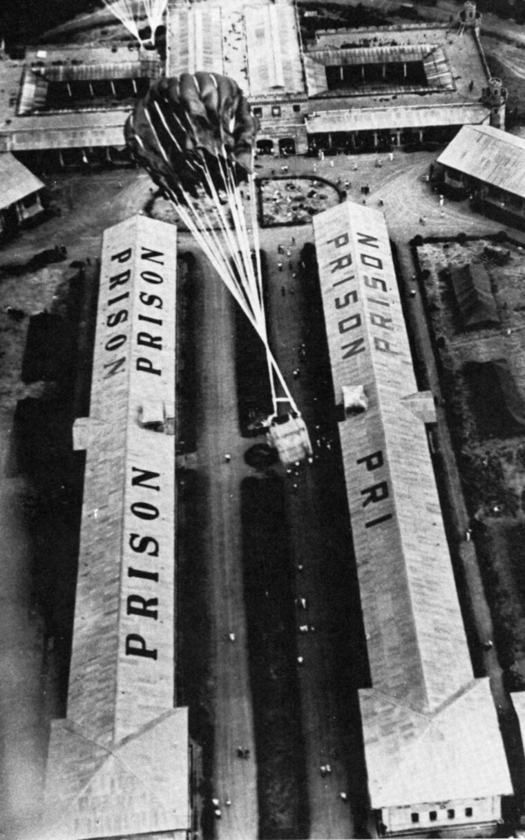 Food and medicine are dropped by parachute at Bilibid prison in the Philippines in February 1945.