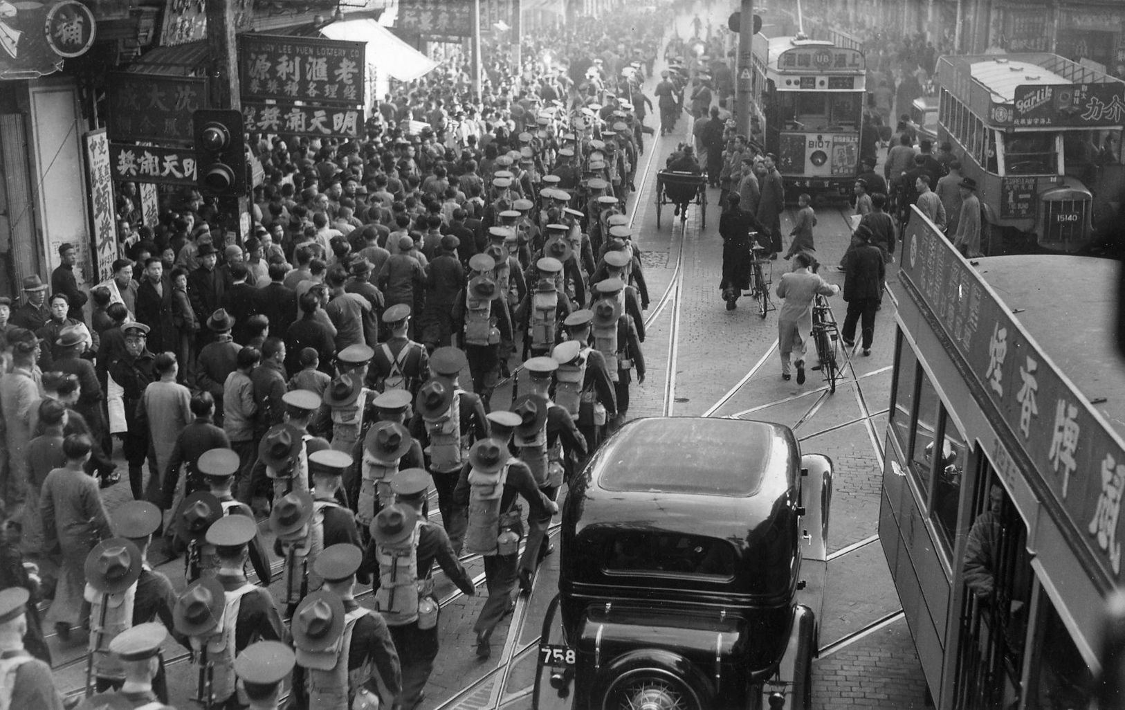 During the uneasy days of the 1930s, a U.S. Marine Corps band marches through the streets of Shanghai. The most cosmopolitan of Chinese cities, Shanghai was home to a large enclave of European and American expatriates. 