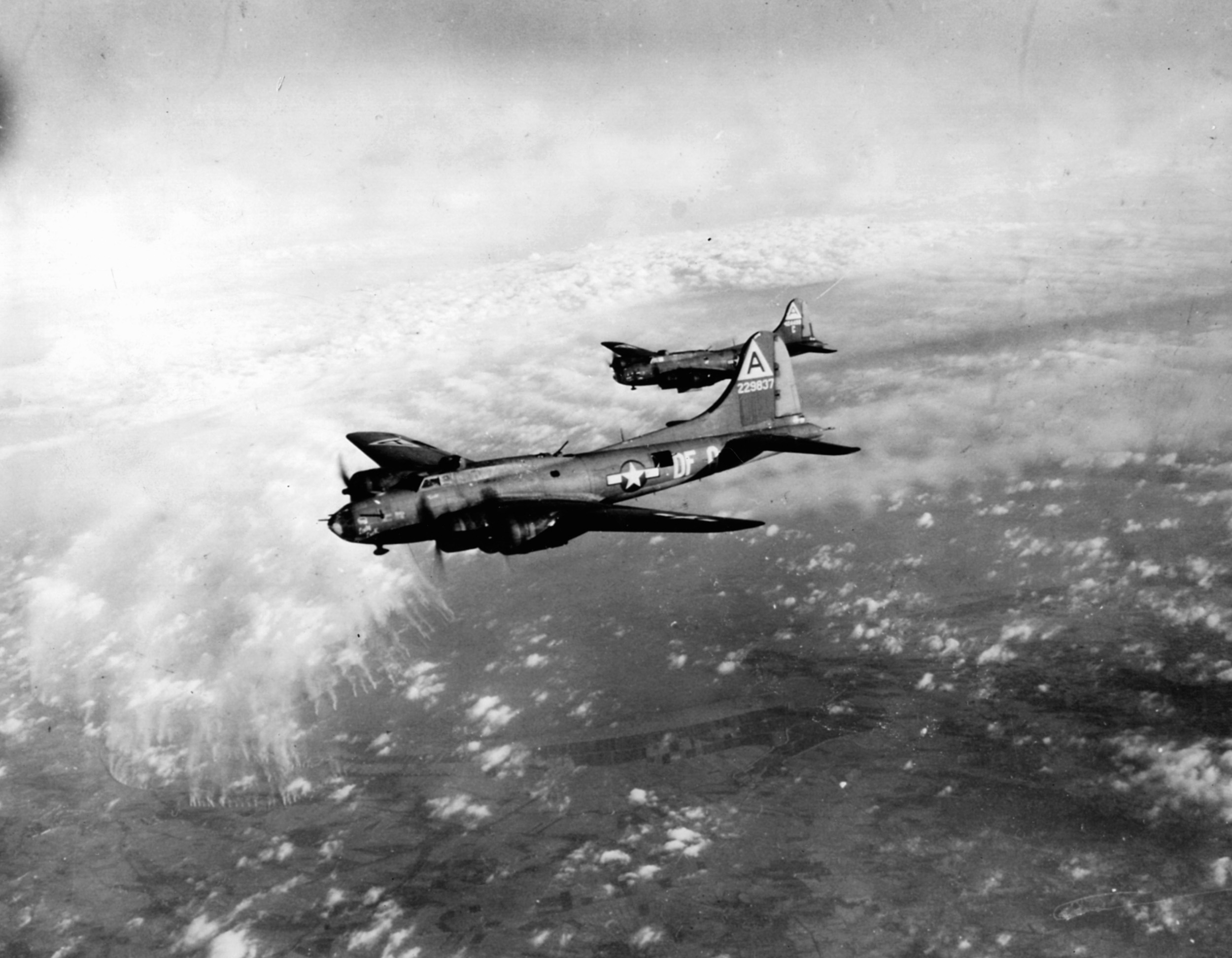 B-17s from the 91st Bomb Group encounter flak over Bremen. Enemy fighters also braved the flak, flying to within 25 yards of the American bombers.