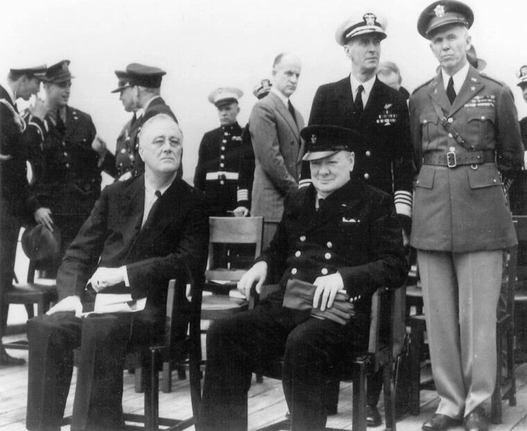 President Roosevelt, Prime Minister Winston Churchill, Admiral Ernest King, and General George C. Marshall, meet at the Trident Conference in Washington D.C., May 1943.
