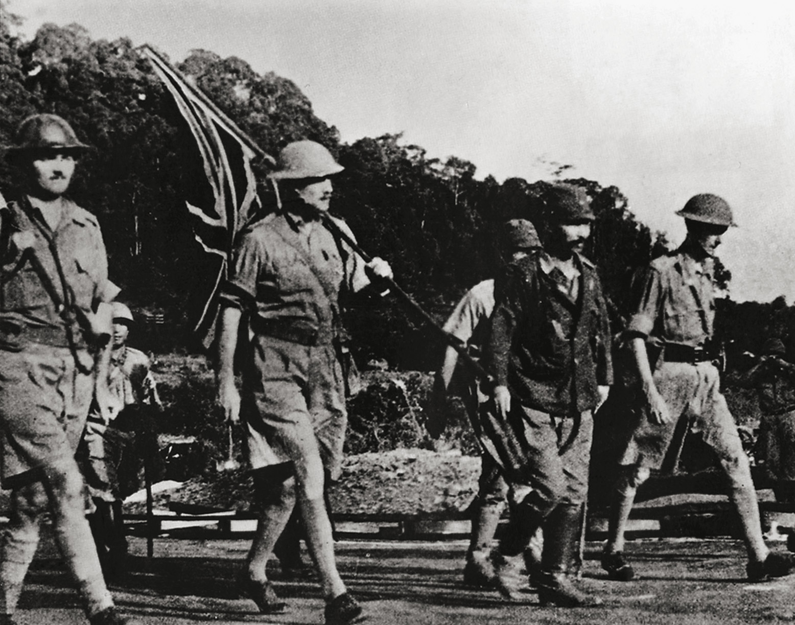 After one of the greatest disasters in British military history, British General Arthur Percival marches begrudgingly towards Japanese lines to surrender his force of 130,000 men in Singapore.