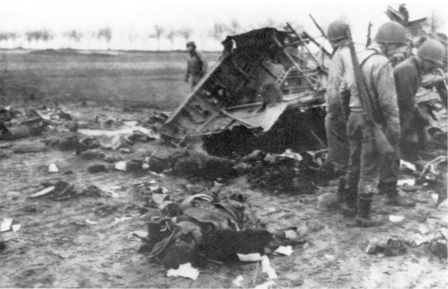 American soldiers examine remains of a Junker-52 paratroop transport shot down early on December 17. Radio messages about the transports should have tipped commanders to the attack.