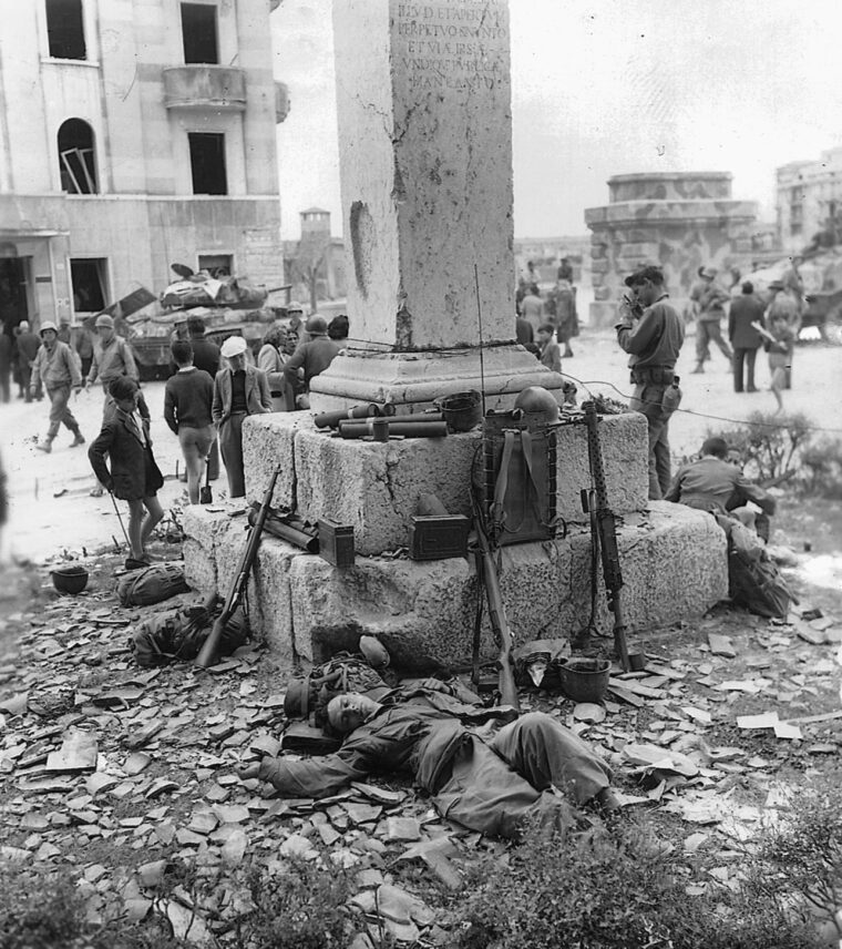 Civilians do not disturb this 10th Mountain Division soldier as he sleeps in a square in Verona, Italy.