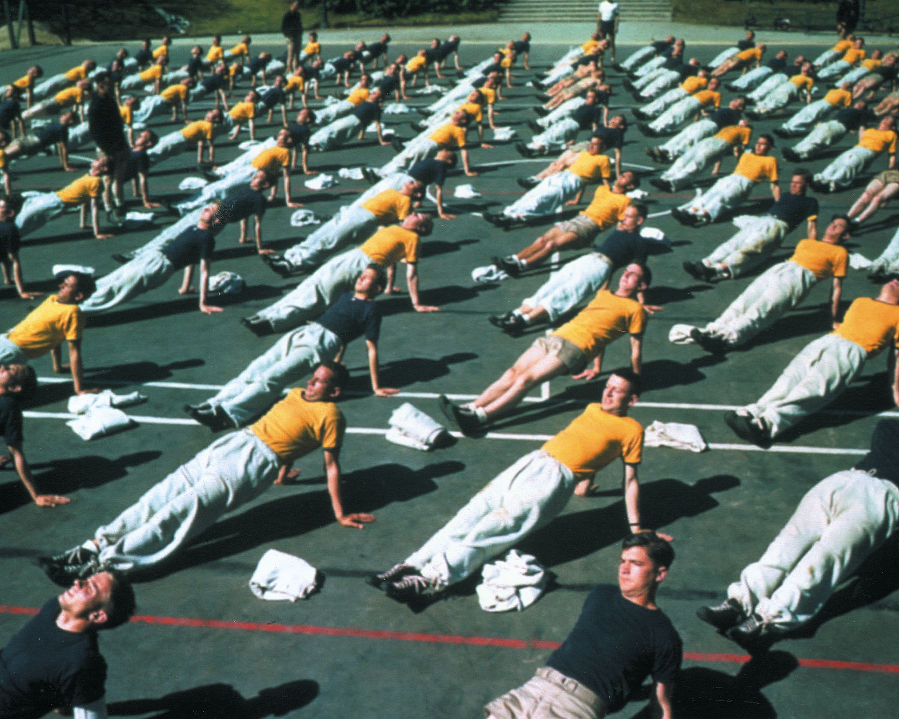 Naval aviator cadets perform calisthenics exercises at Del Monte pre-flight school.