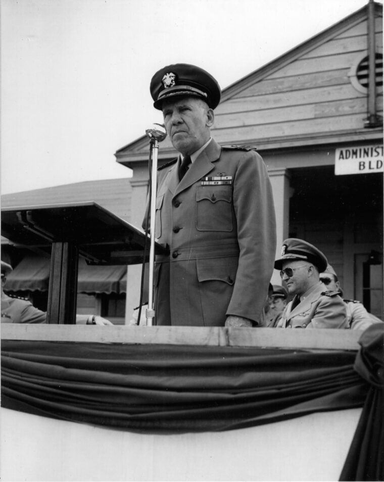Commander Corydon Wassell addresses NAS personnel after returning home to the United States.