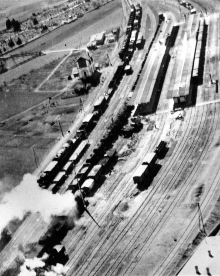 A railyard in Austria comes under attack by U.S. fighter-bombers. The Gold Train, laden with plundered treasures from Eastern and Central Europe, narrowly escaped destruction during such a raid.