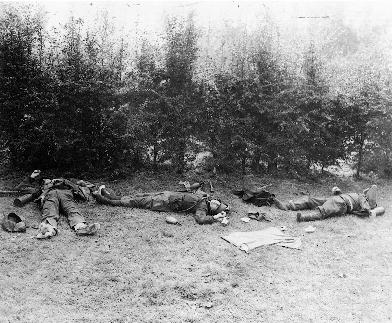 Stripped of their shoes and other much-needed supplies by their comrades, the bodies of three German soldiers lie in the Dutch countryside.