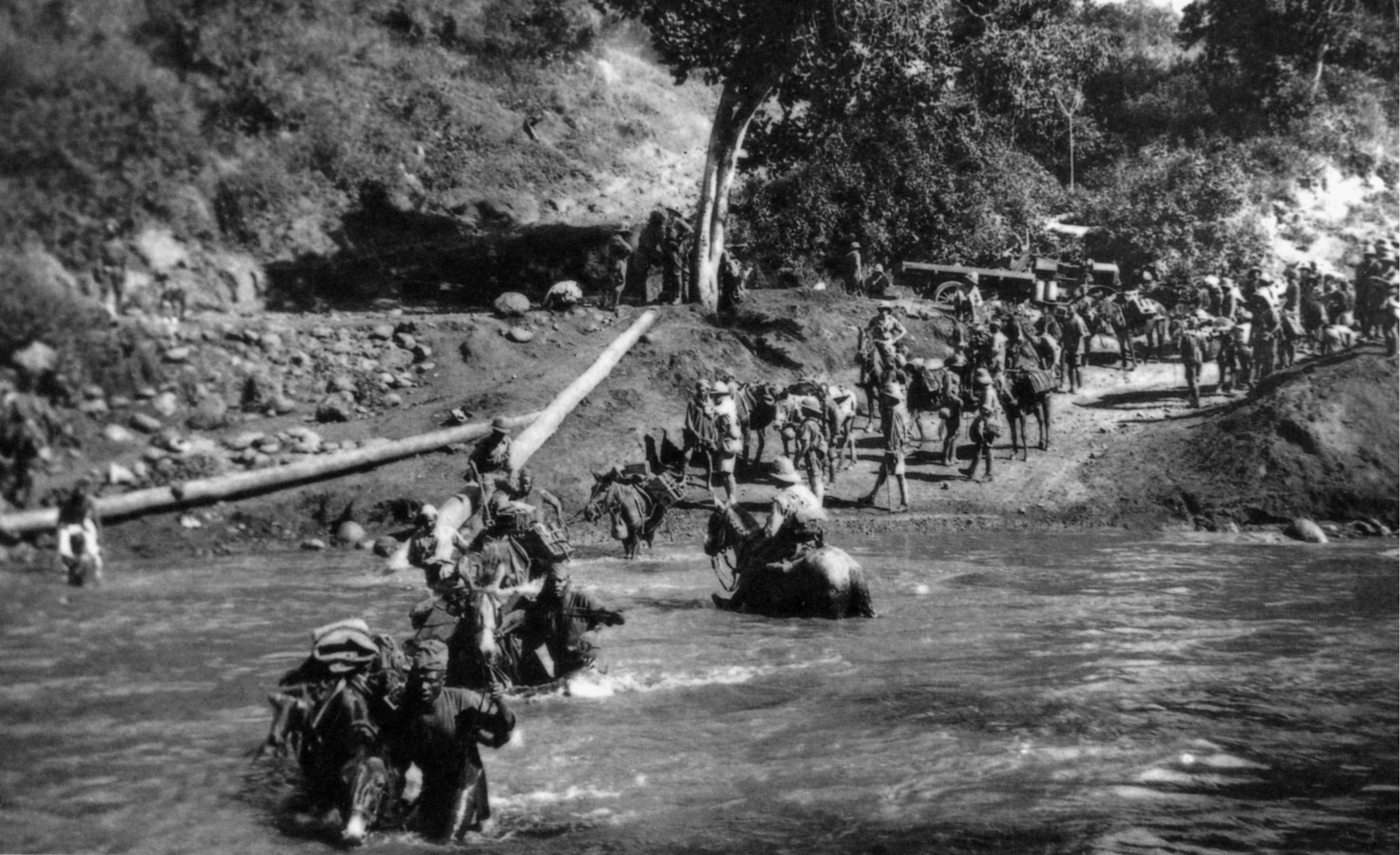 Part of a South African Brigade crosses the Kiakafu River en route to Arusha in April 1916. Primitive conditions took a toll on men and horses. 
