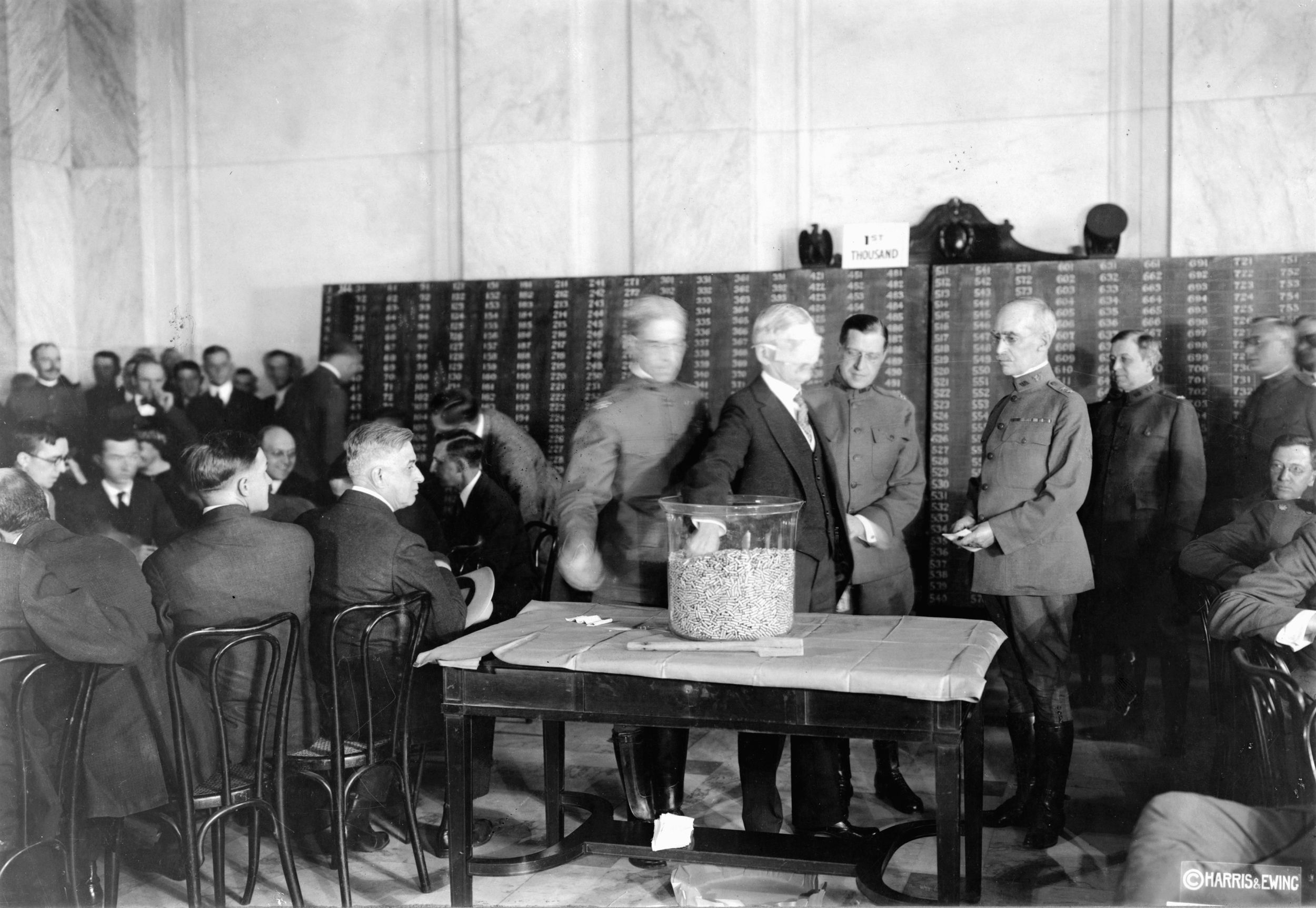 Vice President Thomas R. Marshall draws a draft capsule from a bin during a ceremony in 1918. Nearly 3 million men were drafted in World War I.