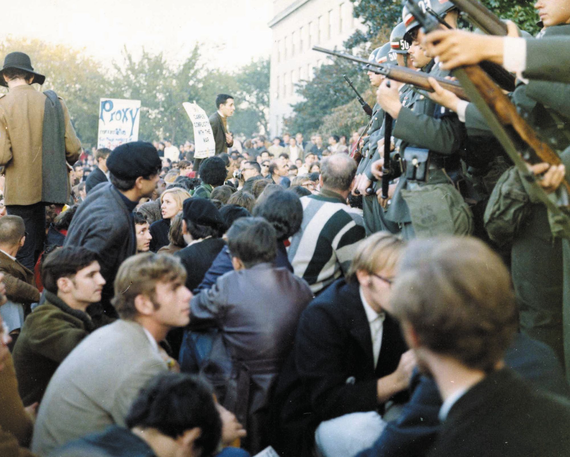 Armed MPs hold back Vietnam War protesters during their sit-in at the mall entrance to the Pentagon on October 21, 1967. 