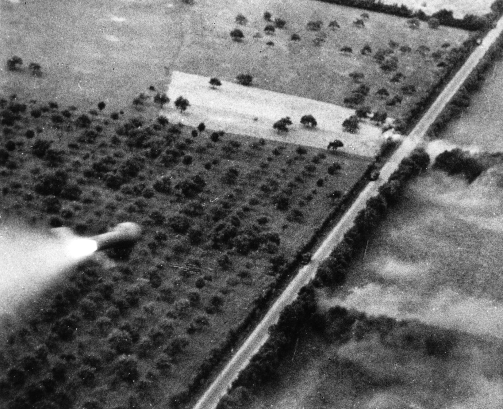 A still from film footage shows a rocket from a Hawker Typhoon heading toward German motor transports attempting to escape through the Argentan-Falaise gap near Livarot.