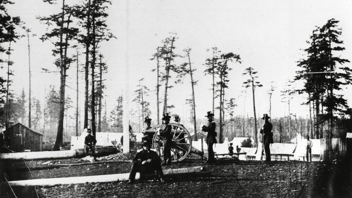 American soldiers man an artillery post on the south end of San Juan Island. A dispute over the boundary between Washington Territory and British Columbia almost led to an armed conflict between the United States and Great Britain in 1859.