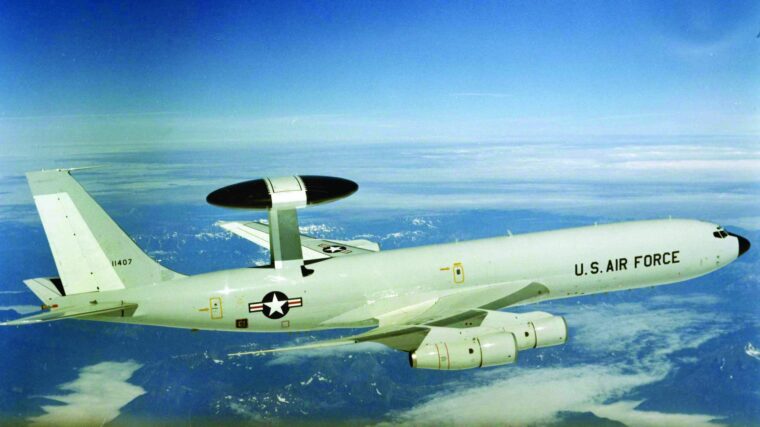 A view of an E-3 aircraft with AWACS radome mounted on top.
