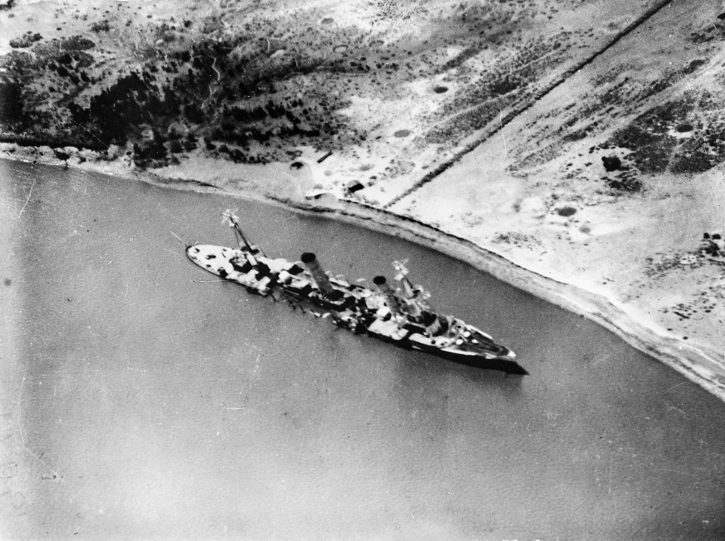 Konigsberg lists helplessly on the Rufiji River after being scuttled by her crew in July 1915.