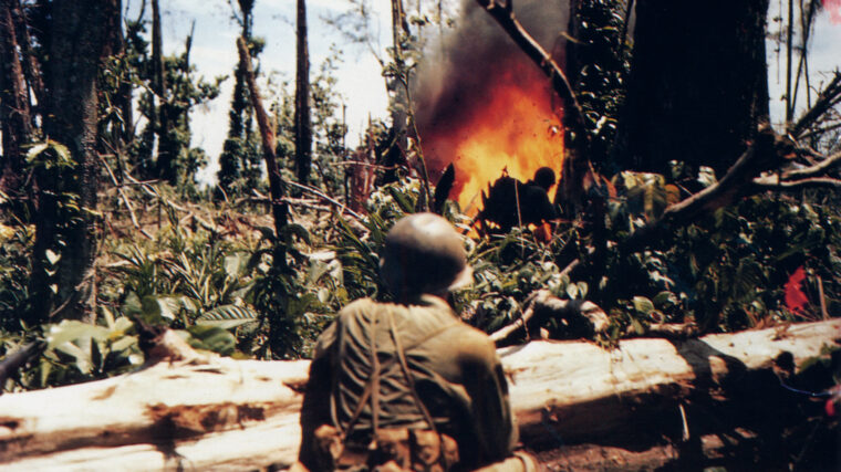 Marines use a flamethrower at the top of the Soloman Islands, a misery of jungles, snakes, and Japanese snipers.