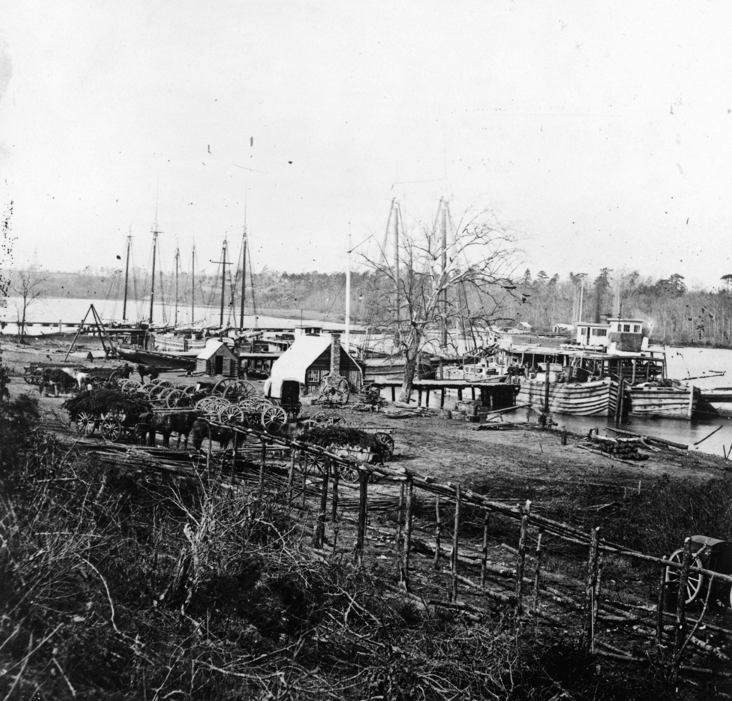 Matthew Brady’s photograph of Broadway Landing was taken at the time of the Battle of the Crater. Cobb’s Hill Signal Tower and the pontoon bridge are clearly visible on the left.