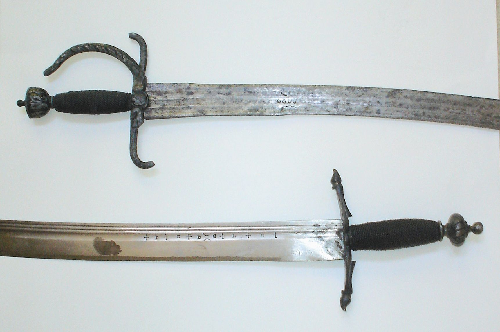Curved swords shown in detail.