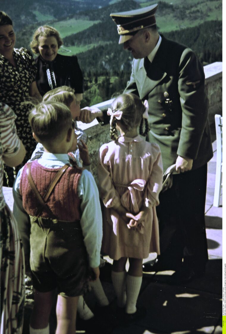 Adolf Hitler greets the family of Reich Minister of Armaments Albert Speer late in 1942. Two of the three children are young Albert and Hilde Speer.