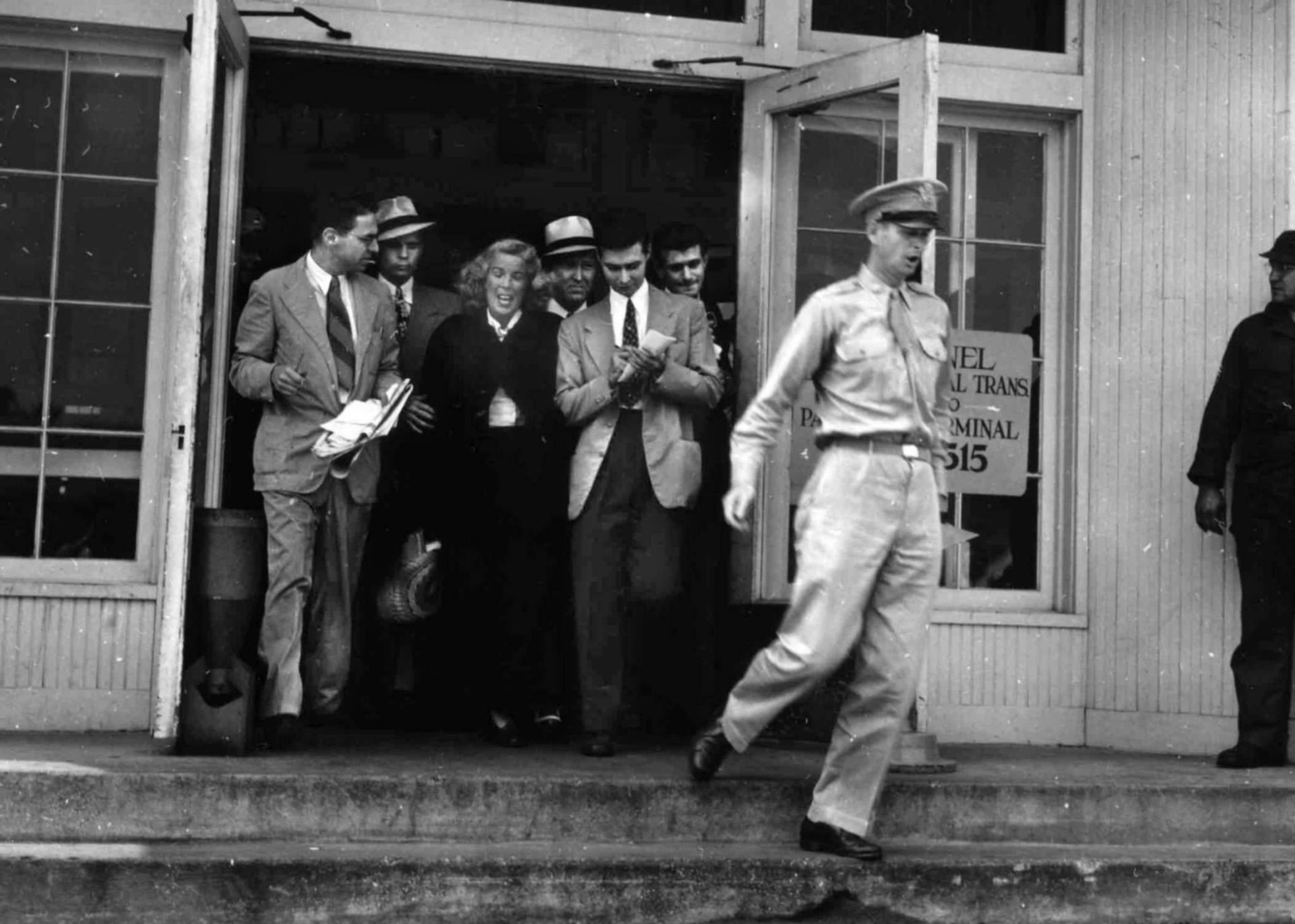 Gillars speaks to reporters upon her return to Washington, D.C. On the witness stand, she stood by everything she did while employed in the service of the Nazi propaganda machine.