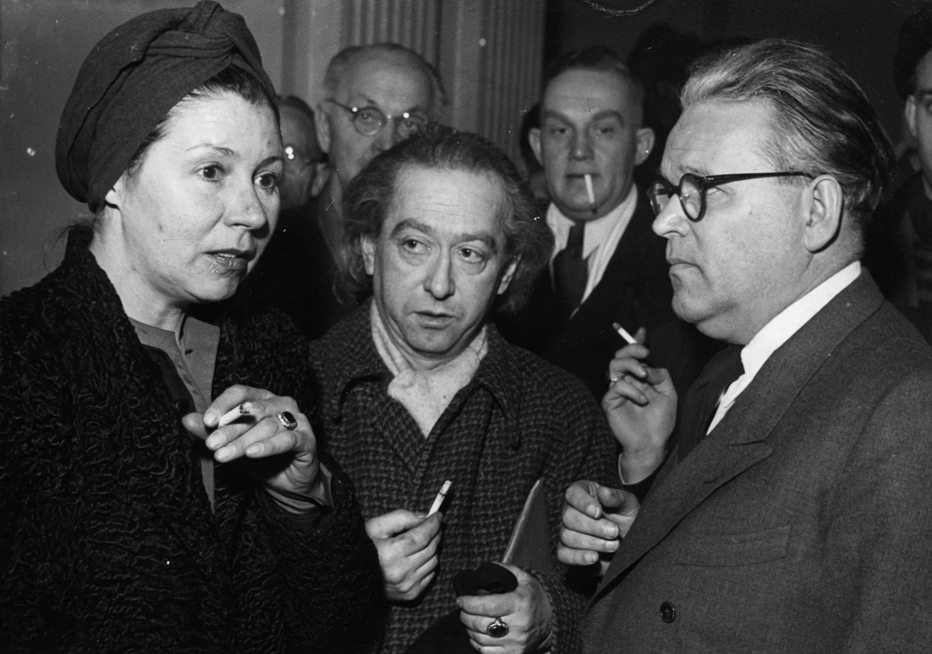 During a break in his postwar trial, director Veit Harlan (right) converses with the widow of actor Ferdinand Marian, who played the title role in the film. Jud Suss was later banned in many countries.
