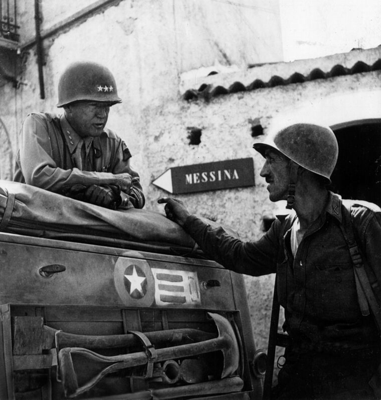 General George Patton and Lt. Col. Lyle B. Bernard of the U.S. 30th Infantry Regiment discuss a plan of attack on the outskirts of Messina.