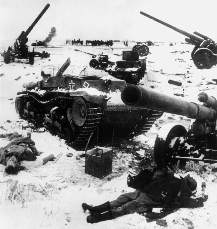Corpses and the wreckage of tanks and guns lie strewn about at a former German position around Stalingrad. The overwhelming strength of Russian firepower and superior numbers left many German units devastated.