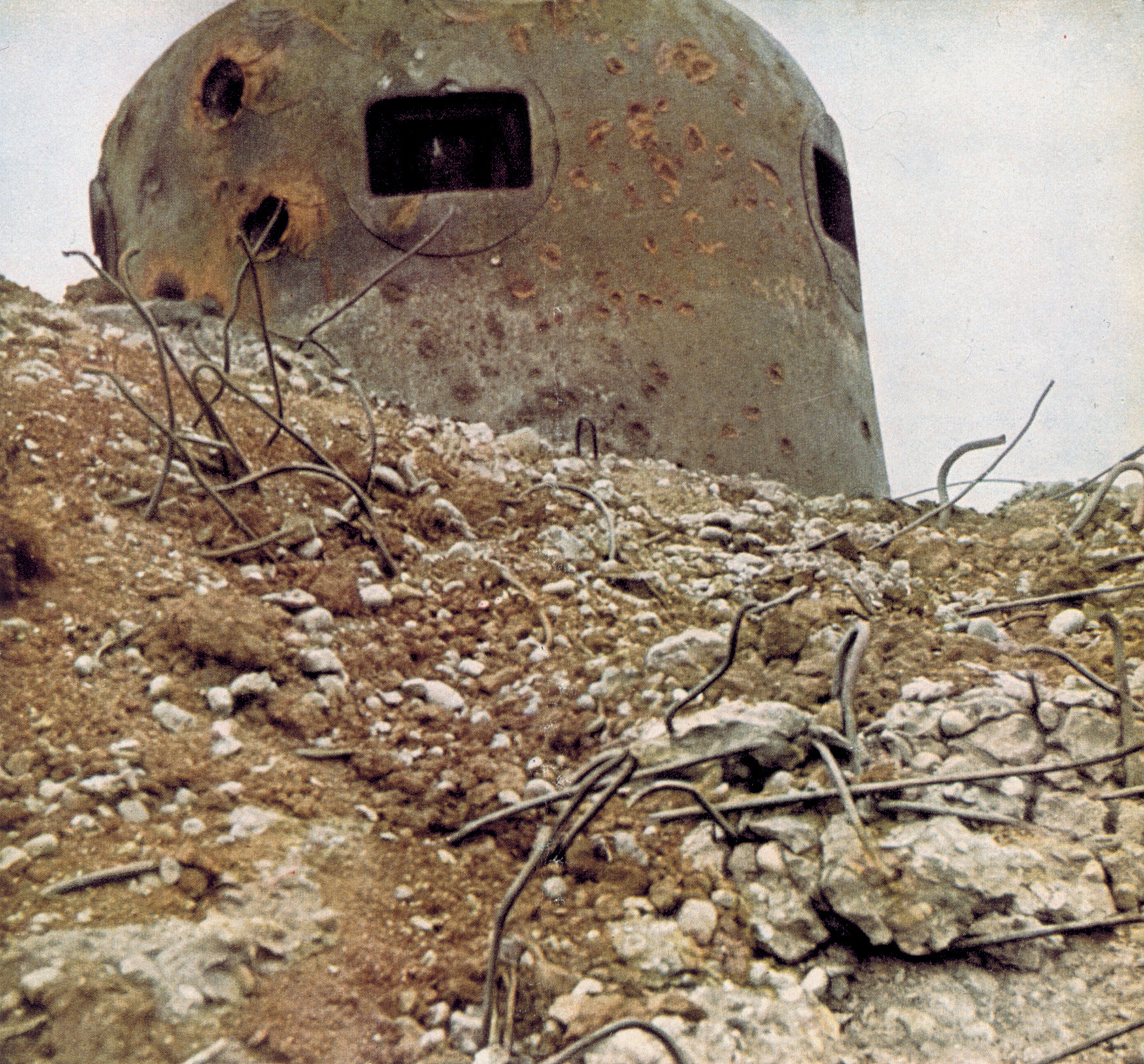 Bearing scars from the artillery fire of its attackers, this Maginot artillery bunker was silenced by the Germans.