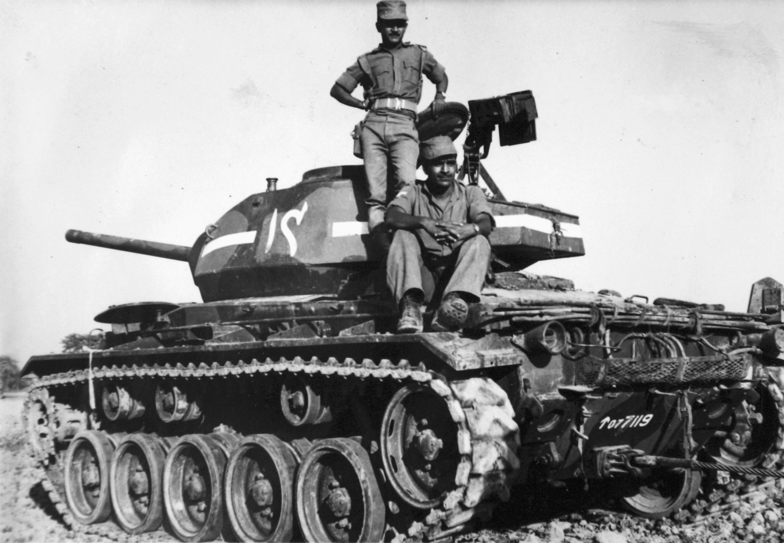 Indian troops pose with a captured Pakistani Chafee tank at Longewela. 