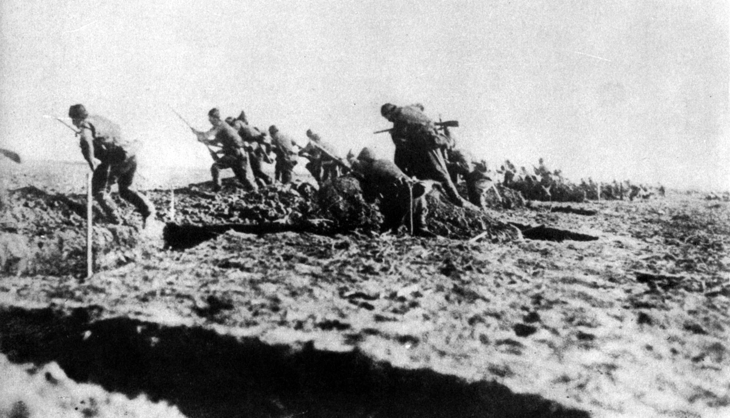Turkish infantry, fighting on their home soil, spring from the trenches to counterattack British and ANZAC forces at Gallipoli. Some 218,000 Turkish casualties were suffered during the campaign, including 66,000 killed.