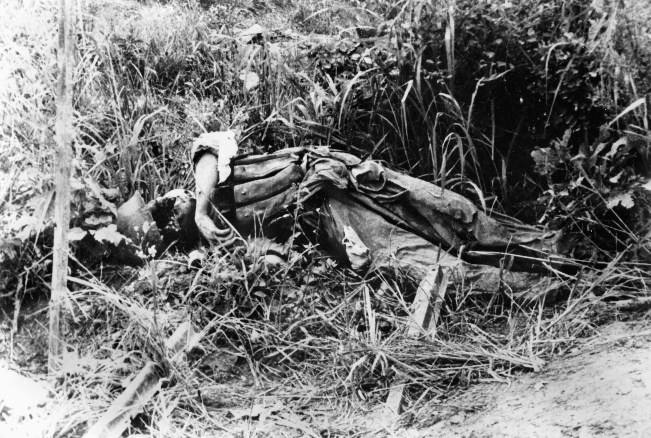Body of a slain Chinese soldier lies outside the Australian-held position in the Hook, late July 1953.