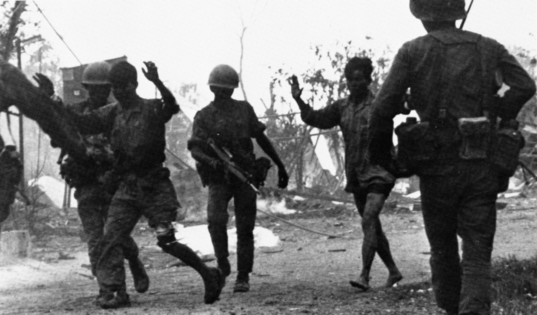 ARVN soldiers bring in North Vietnamese prisoners at the height of the battle.