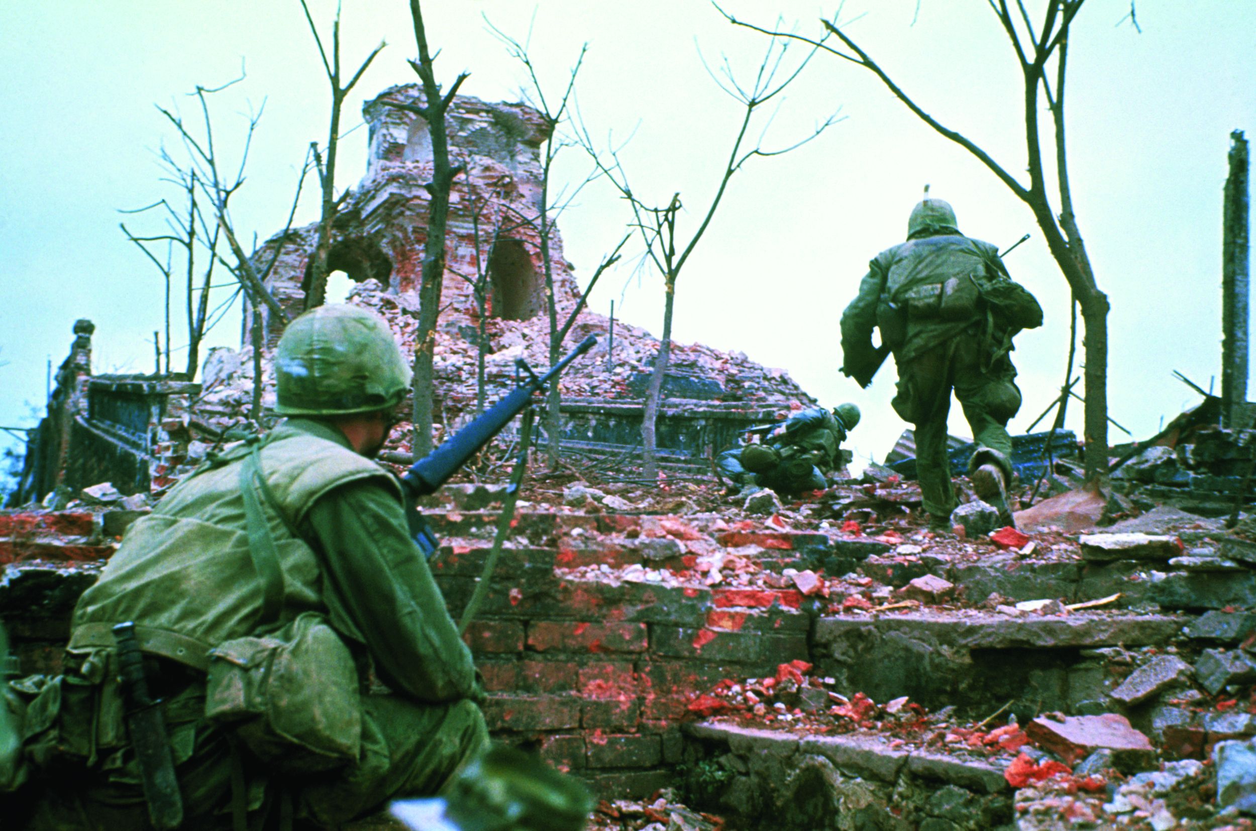 American Marines advance cautiously up the outer walls of the Citadel at Hue on February 13, 1968, following the surprise attack by North Vietnamese and Vietcong forces.