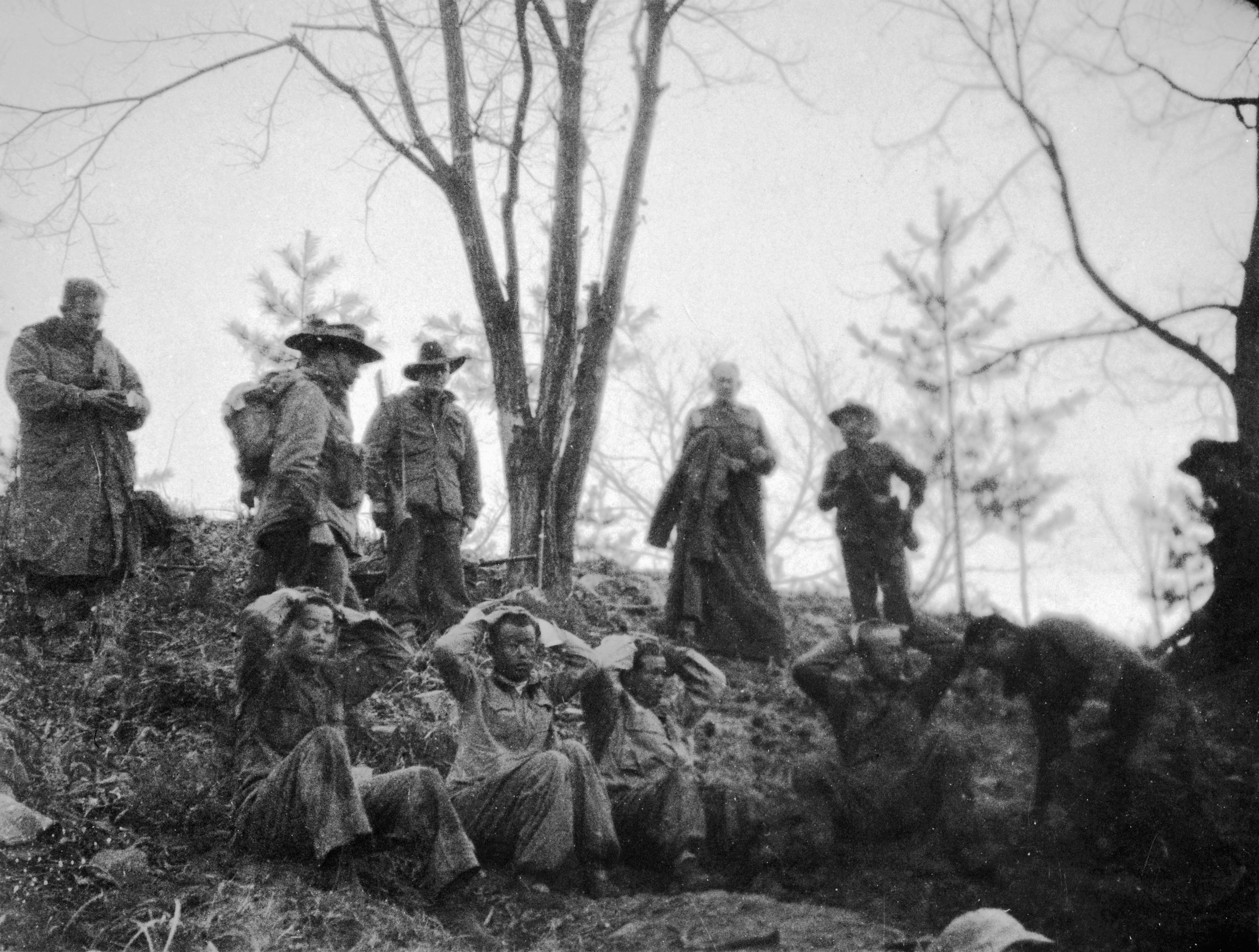 Captured Chinese soldiers are guarded by Australian troops in the 3 RAR after the April 24, 1951, fighting around Kapyong.